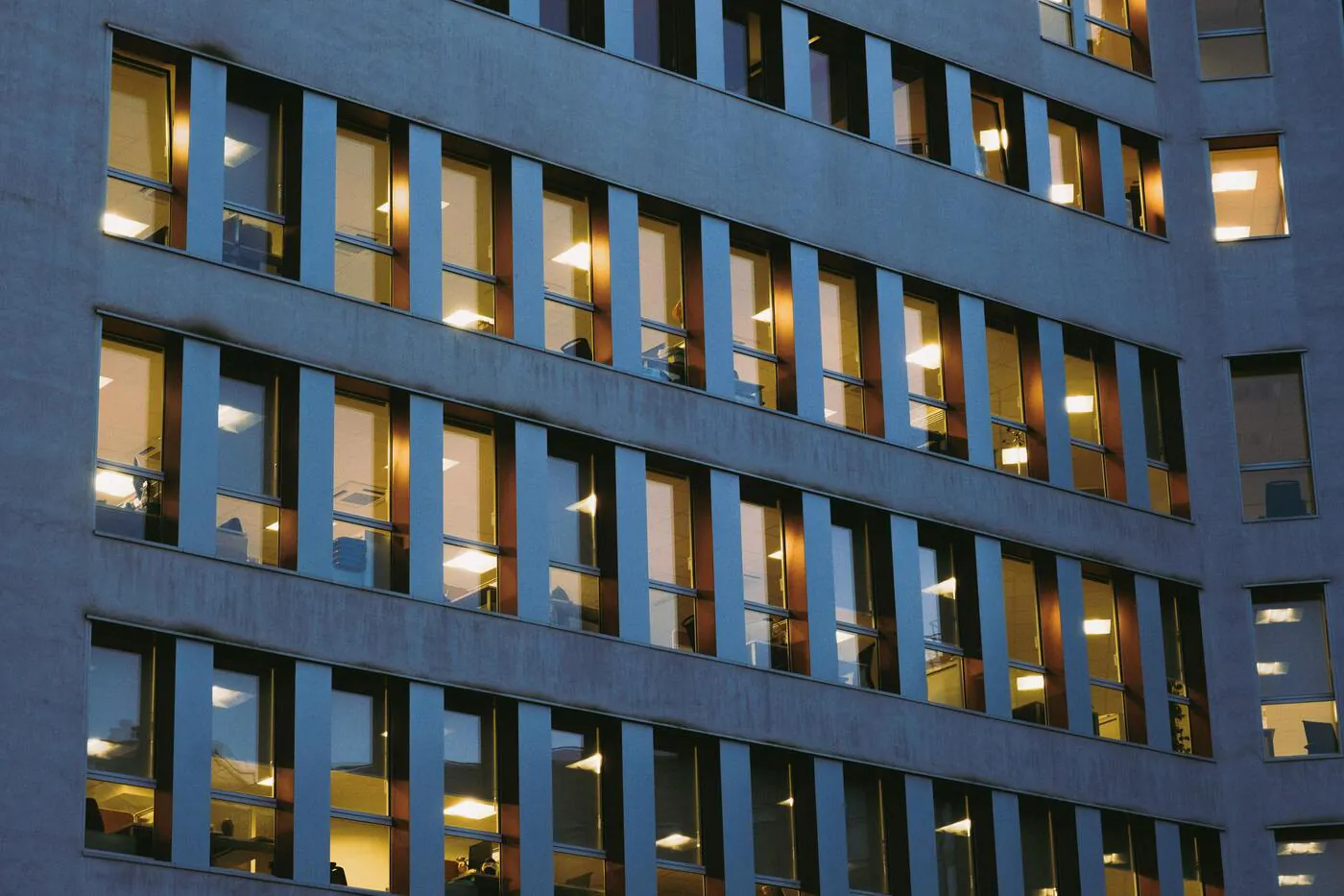 Office building with lit windows at dusk